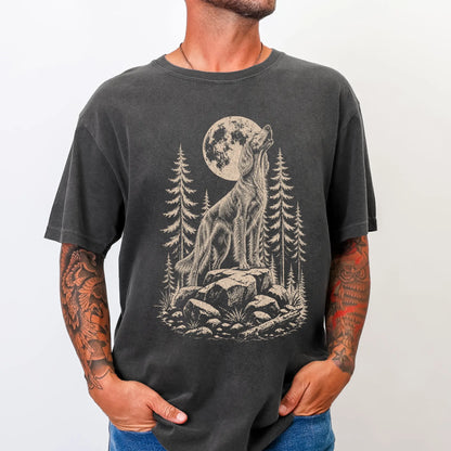 Model wearing a Pepper Comfort Colors® T-shirt with a Irish Setter howling beneath the moon and pine trees