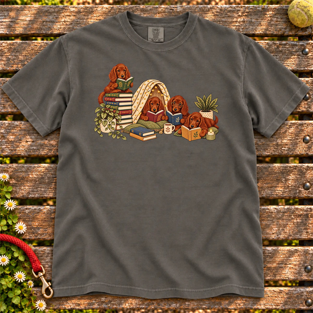 Irish Setter puppies reading books in a cozy blanket fort on a Pepper T-shirt