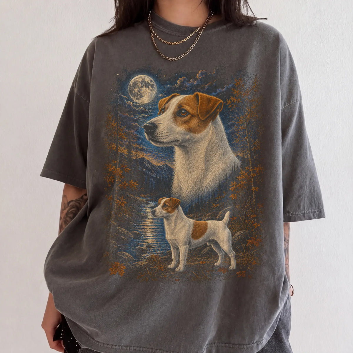 Model wearing a pepper T-shirt with Jack Russell Autumn Moon artwork.