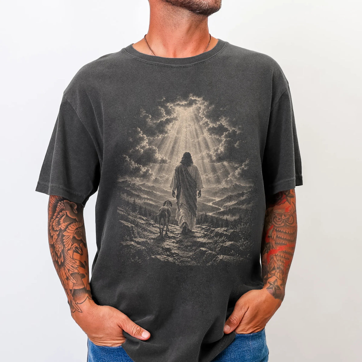 Person wearing a Pepper T-shirt with Jesus walking beside a Vizsla beneath rays of light