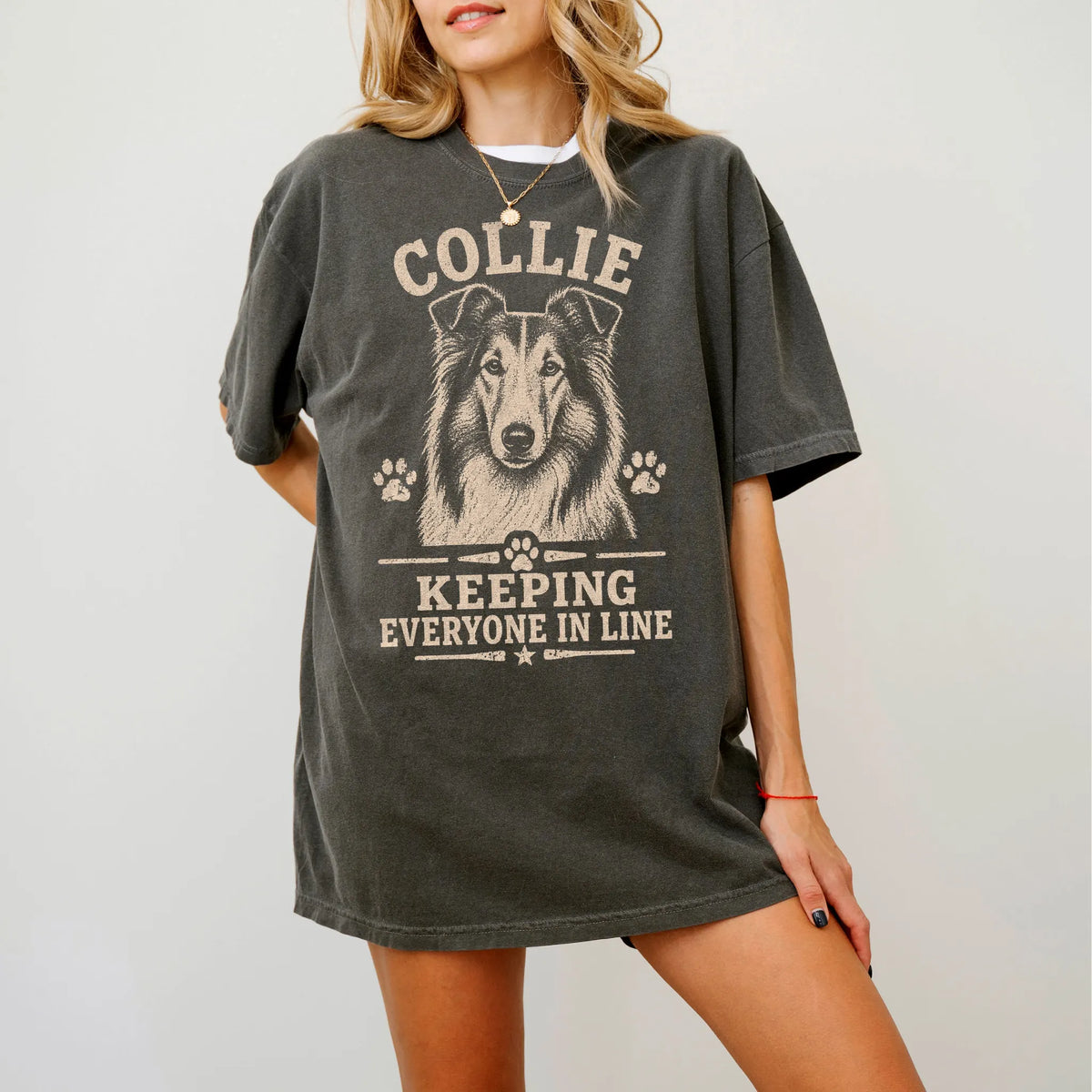 Model wearing a Pepper Comfort Colors® T-shirt featuring Collie design with “Keeping Everyone In Line” lettering