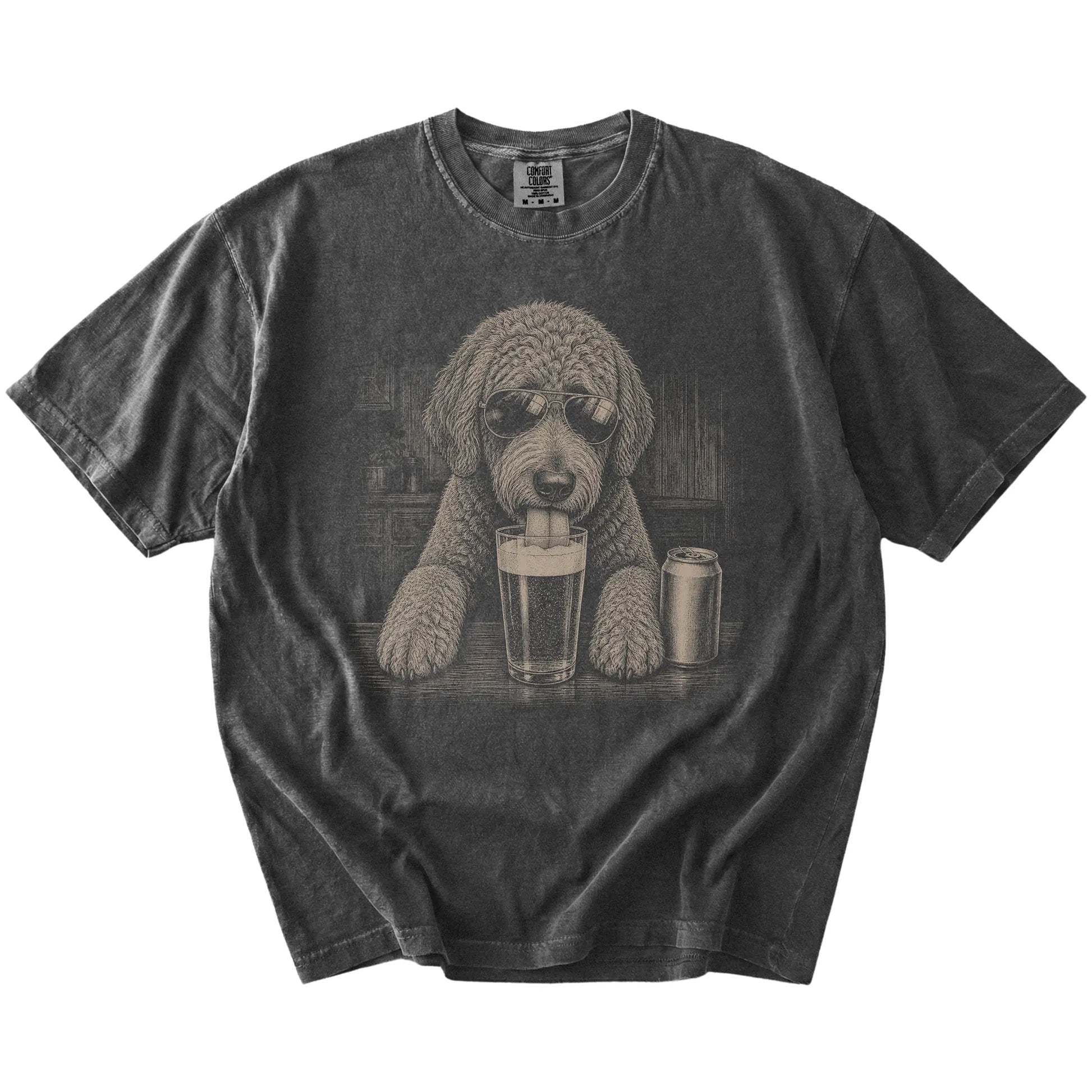 Labradoodle sneaking a drink from a foamy pint at home on a Pepper Comfort Colors® t-shirt