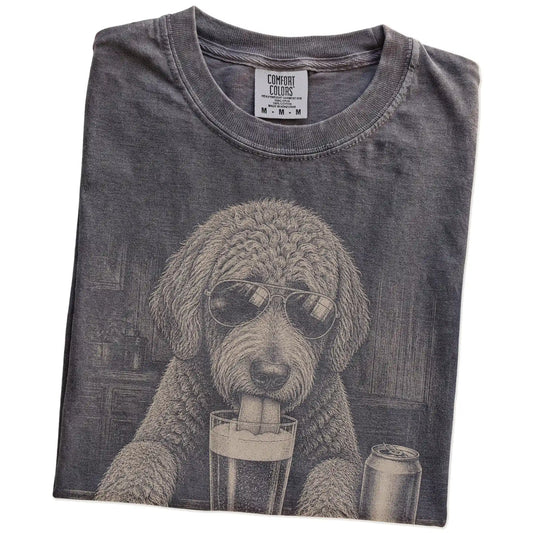 Folded Pepper Comfort Colors® t-shirt showing Labradoodle sneaking a drink from a pint