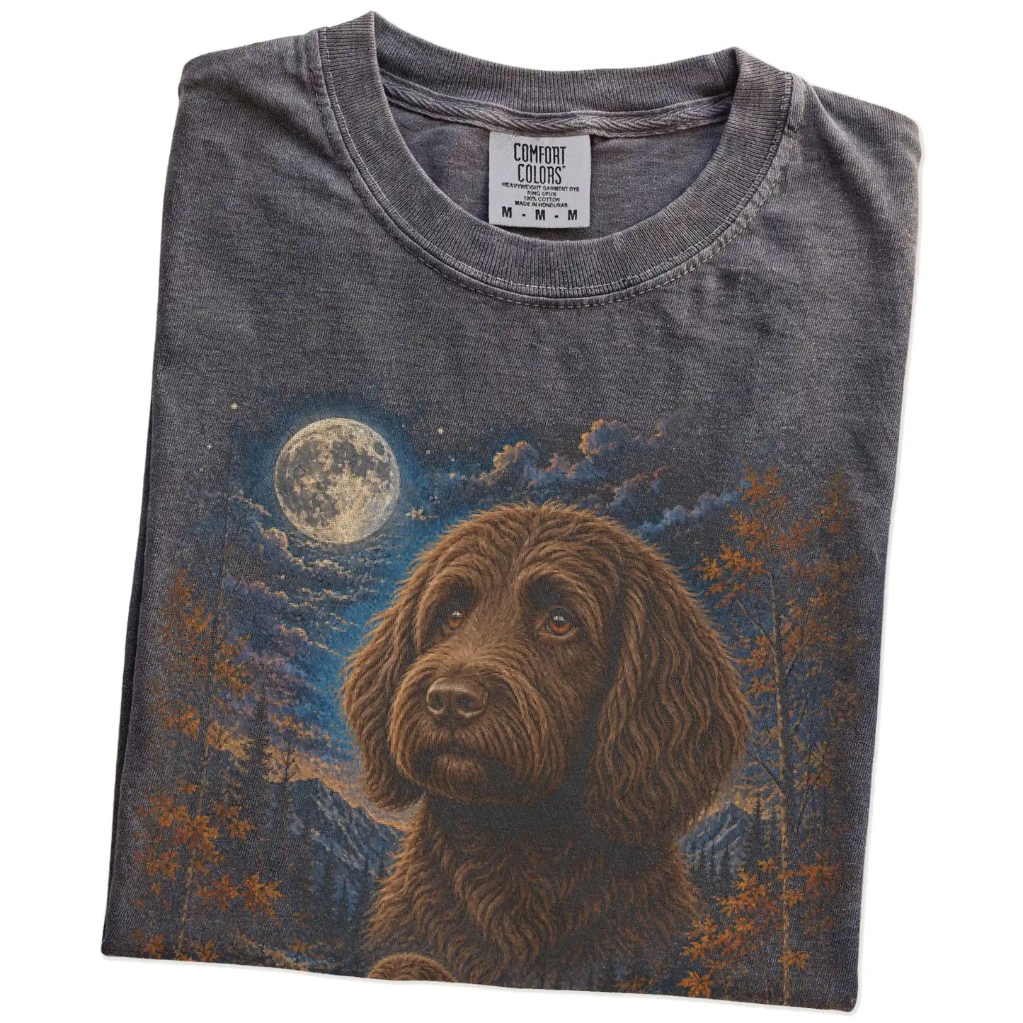 Folded Pepper Comfort Colors® t-shirt showing Labradoodle in a fall forest graphic