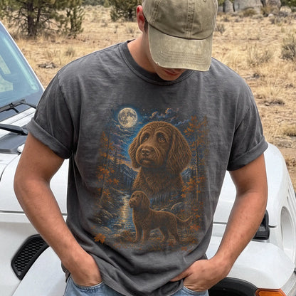 Model wearing a Pepper Comfort Colors® t-shirt featuring Labradoodle in a moonlit fall forest