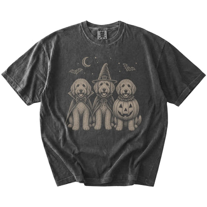 Three Labradoodle dogs dressed for Halloween beneath bats and a crescent moon on a Pepper Comfort Colors® T-shirt