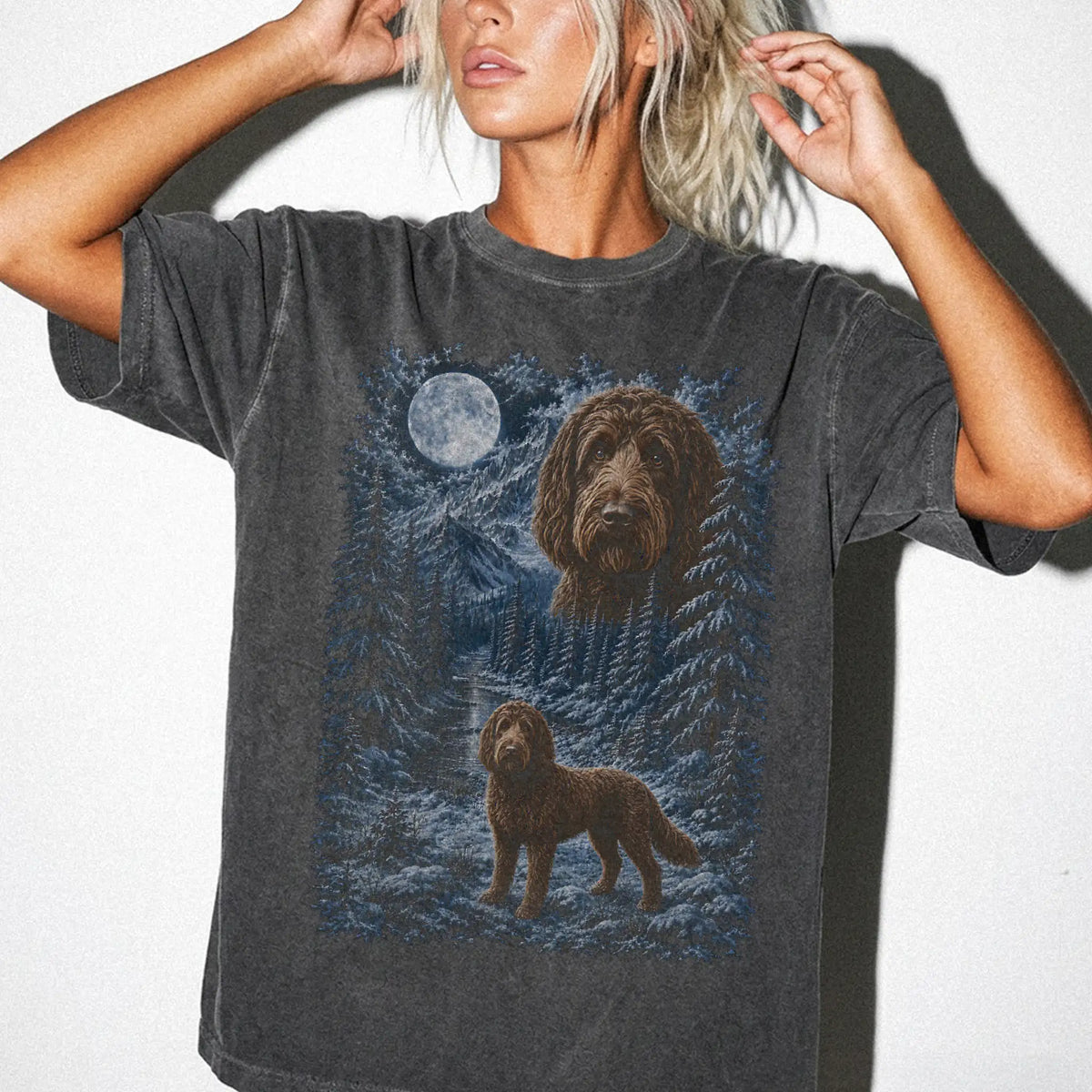 Model wearing a pepper T-shirt with Labradoodle Winter Moon artwork.