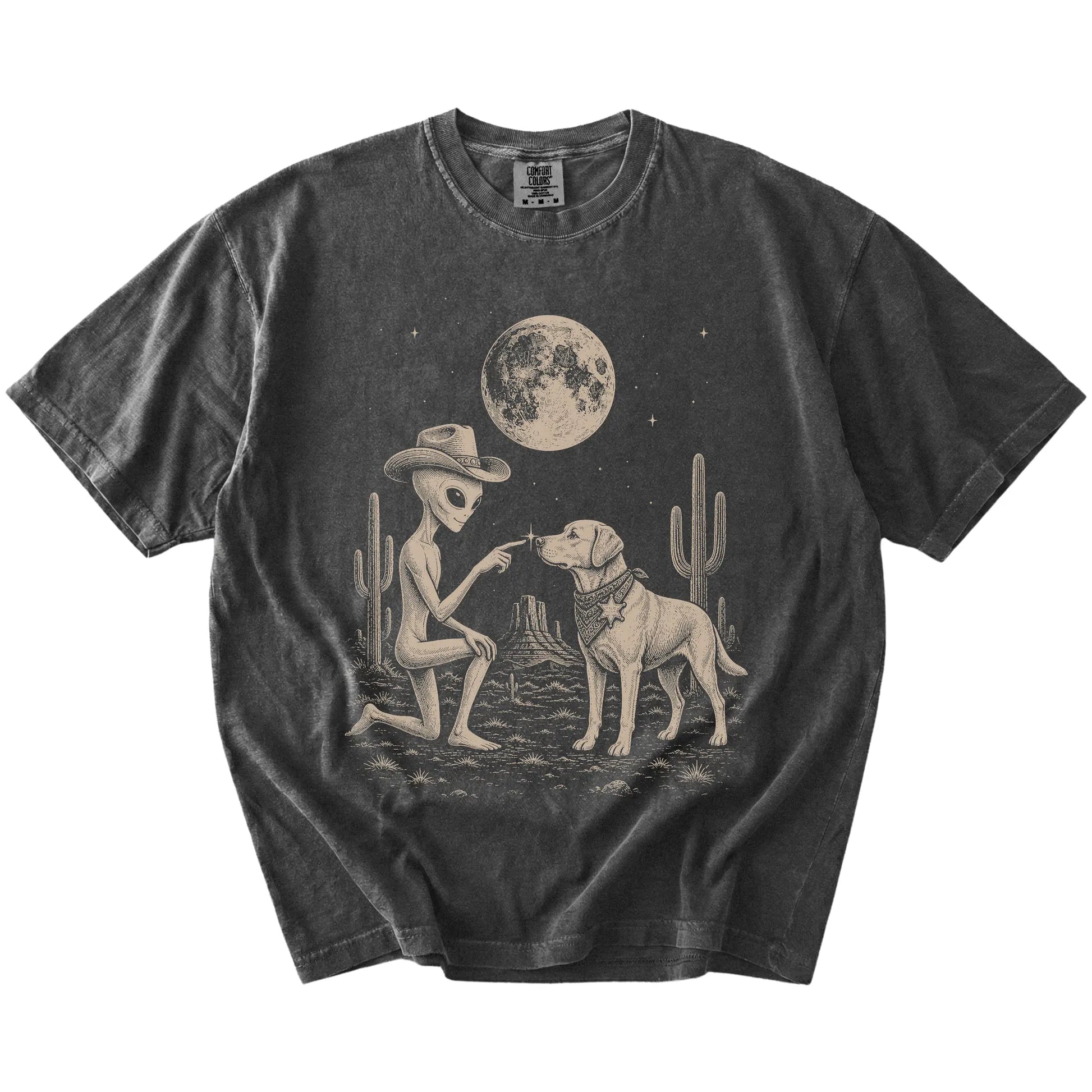 Cowboy alien fist-bumping a Labrador Retriever beneath the moon on a Pepper Comfort Colors® T-shirt