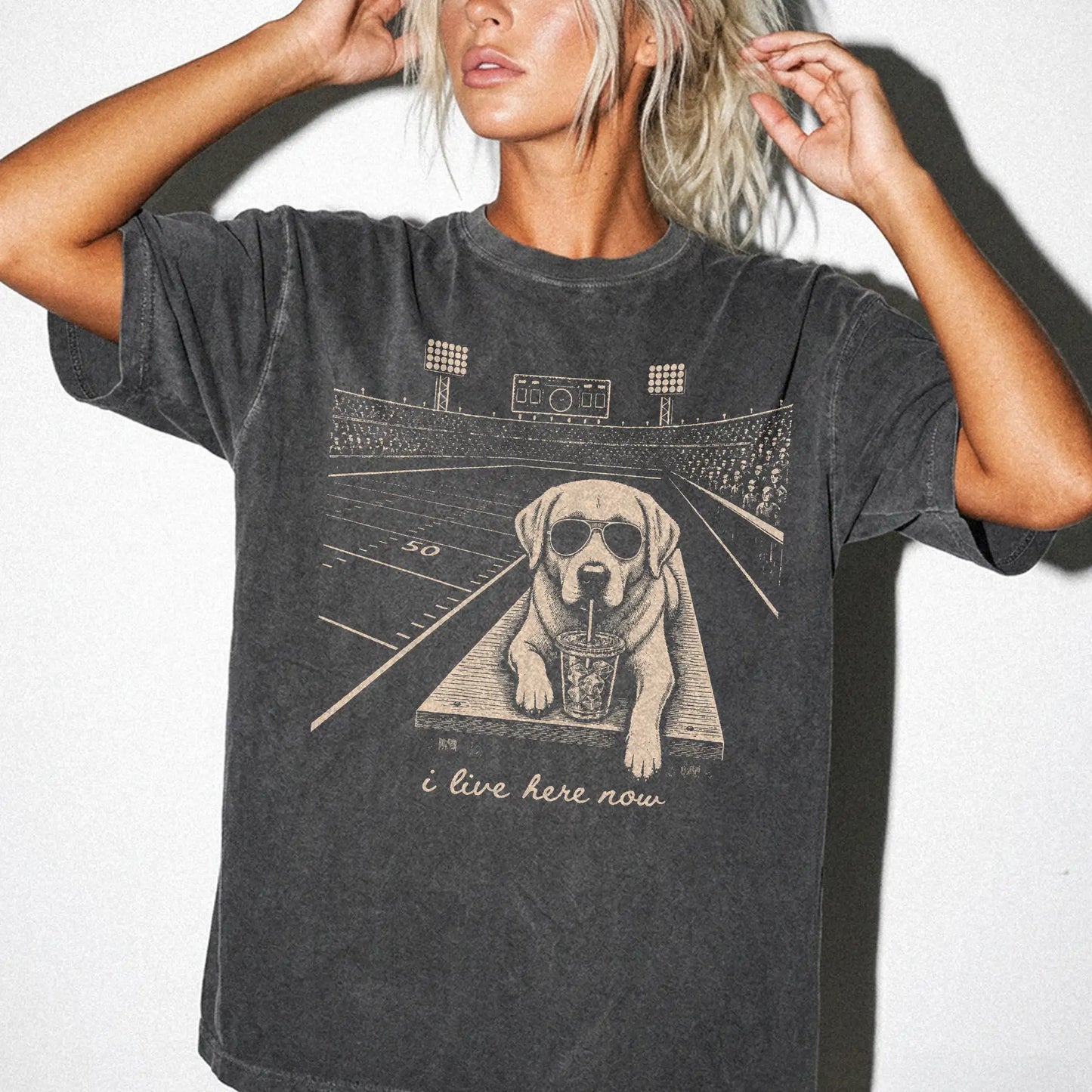 Model wearing a Pepper Comfort Colors® T-shirt featuring Labrador Retriever ready for football and tailgate season