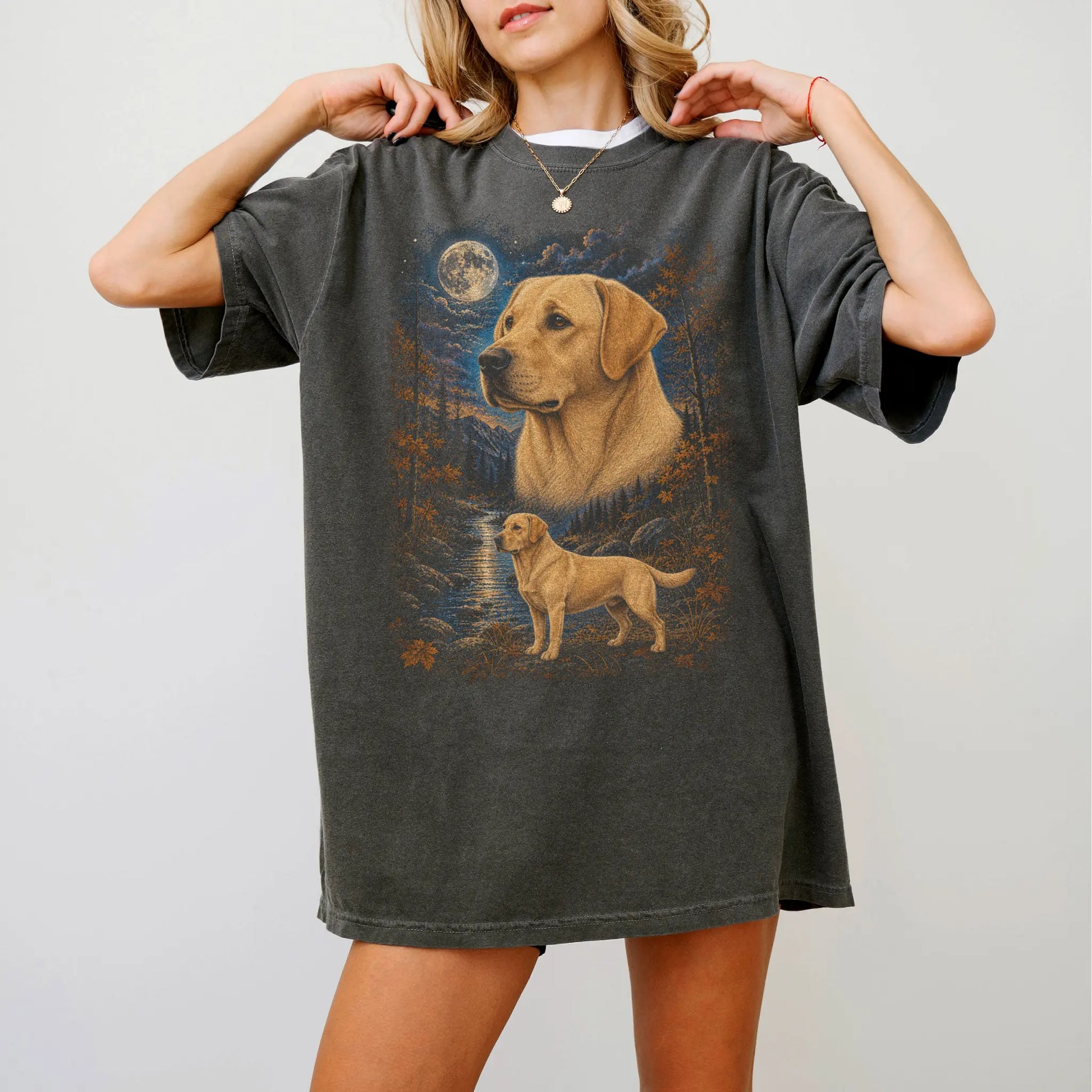 Model wearing a Pepper Comfort Colors® t-shirt featuring Labrador Retriever in a moonlit fall forest
