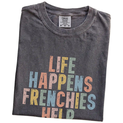 Folded Pepper Comfort Colors® T-shirt showing French Bulldog making hard days better with “Life Happens, Dogs Help” lettering