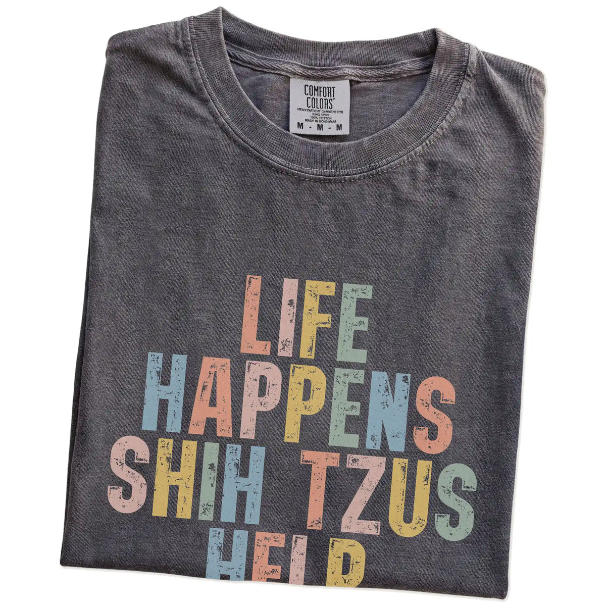 Folded Pepper Comfort Colors® T-shirt showing retro “Life Happens, Shih Tzus Help” lettering