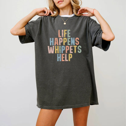 Model wearing a Pepper Comfort Colors® T-shirt featuring the “Life Happens, Whippets Help” saying