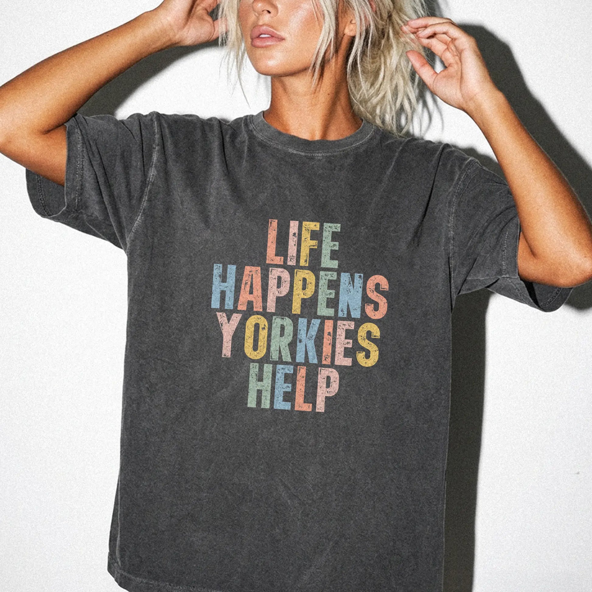 Model wearing a Pepper Comfort Colors® T-shirt with retro “Life Happens, Yorkies Help” lettering