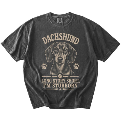 Dachshund design with “Long Story Short, I'm Stubborn” lettering on a Pepper Comfort Colors® T-shirt