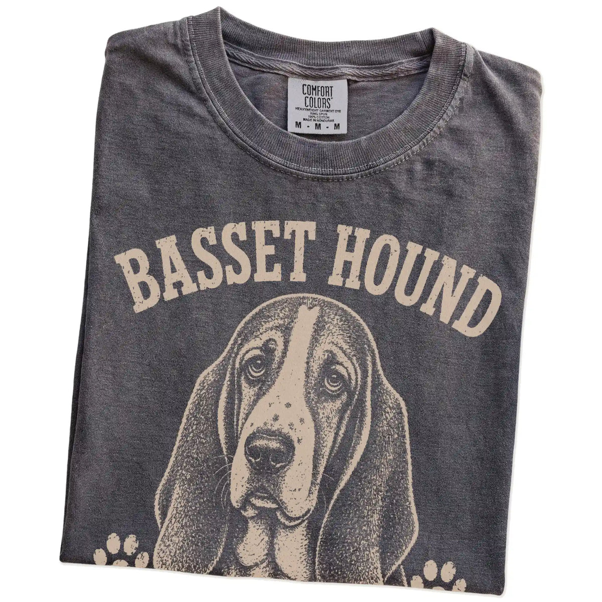Folded Pepper Comfort Colors® T-shirt showing Basset Hound design with “Low Energy, High Standards” lettering