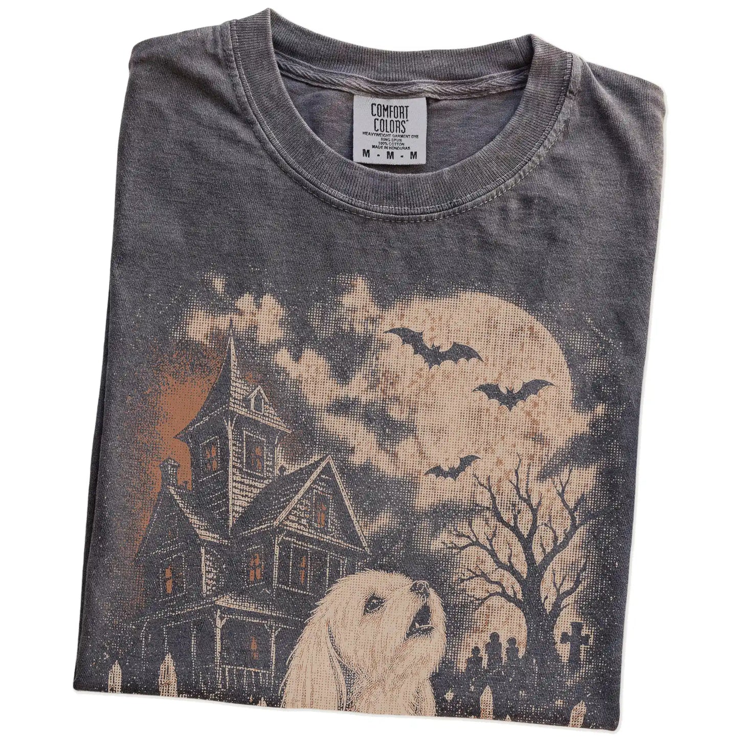 Folded Pepper Comfort Colors® T-shirt showing Maltese in a vintage haunted-house scene