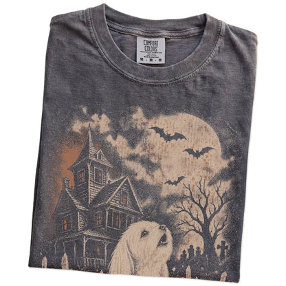 Folded Pepper Comfort Colors® T-shirt showing Maltese in a vintage haunted-house scene