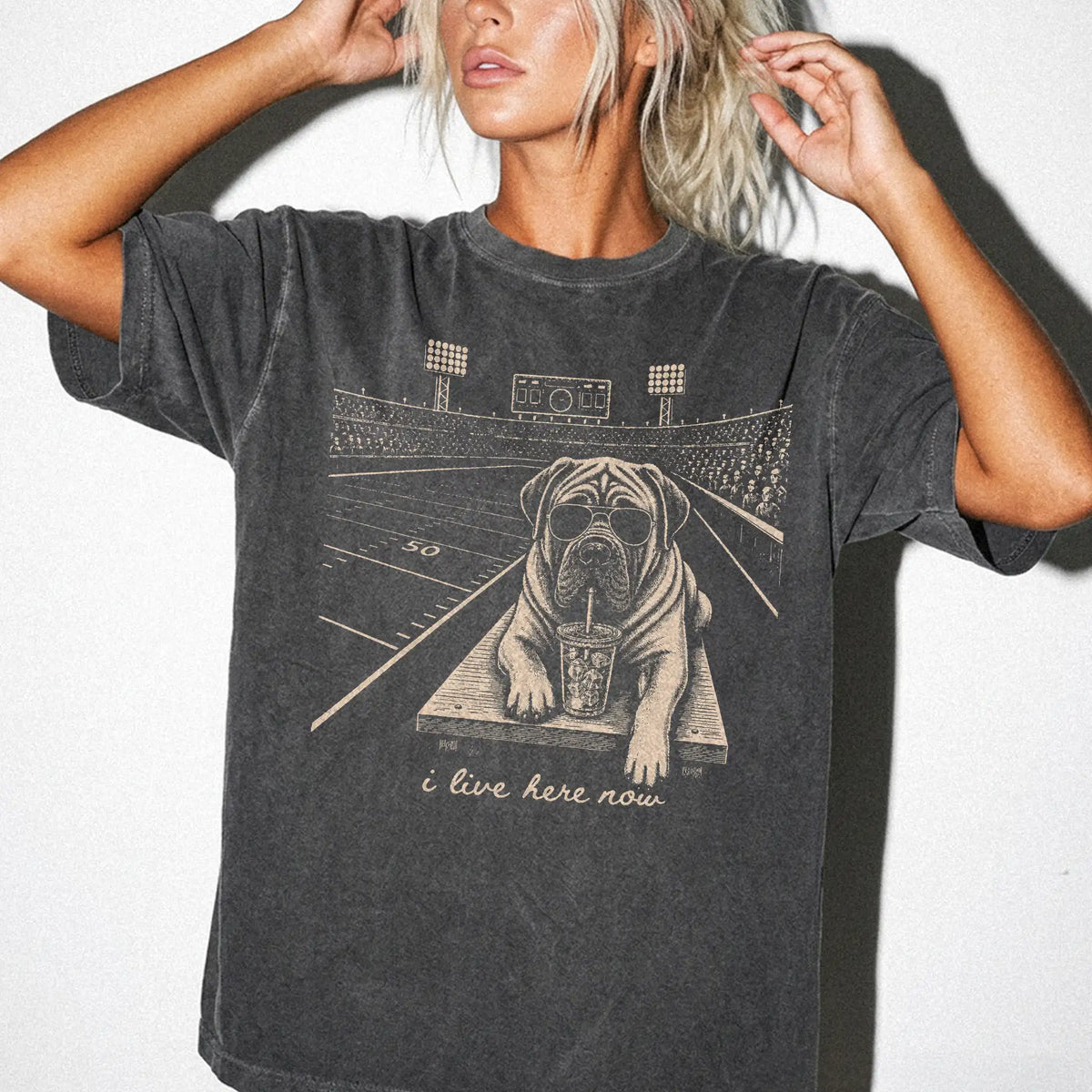 Model wearing a Pepper Comfort Colors® T-shirt featuring Mastiff ready for football and tailgate season