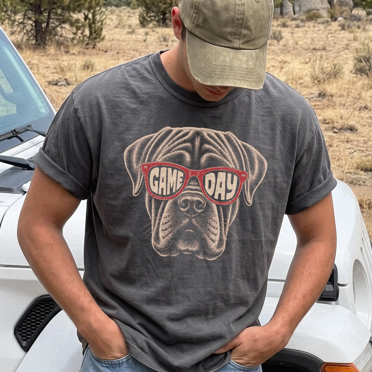 Model wearing a Pepper Comfort Colors® T-shirt with mastiff wearing red game day sunglasses