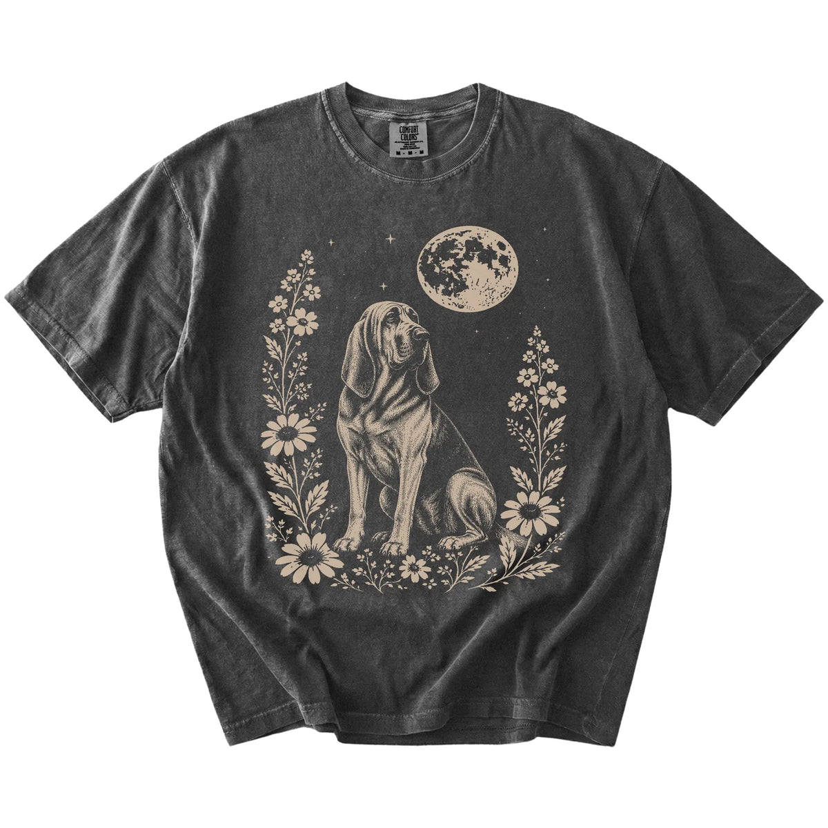 Bloodhound framed by flowers beneath the moon on a Pepper Comfort Colors® T-shirt