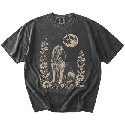 Bloodhound framed by flowers beneath the moon on a Pepper Comfort Colors® T-shirt