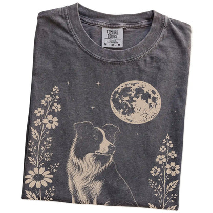 Folded Pepper Comfort Colors® T-shirt showing Border Collie framed by flowers beneath the moon