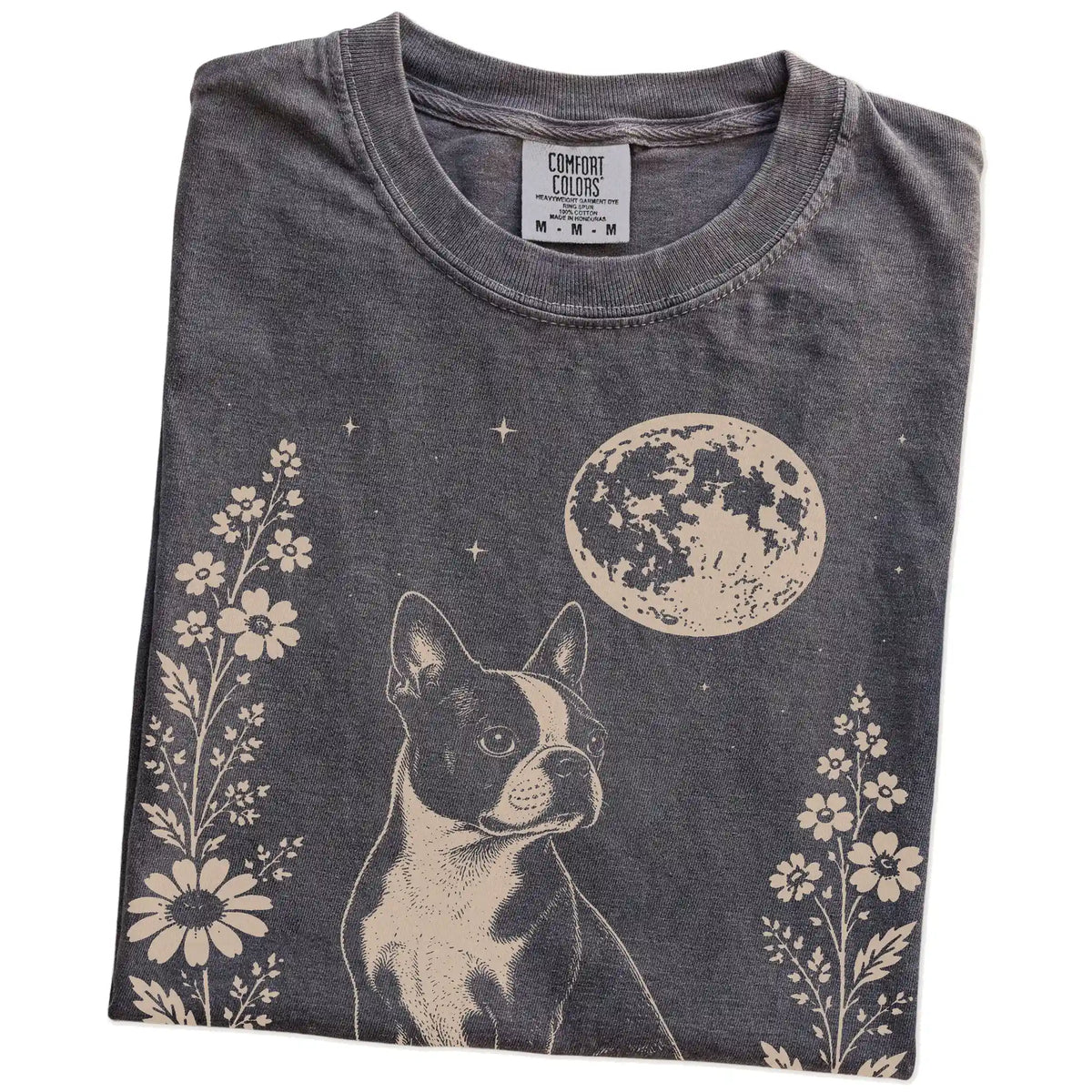 Folded Pepper Comfort Colors® T-shirt showing Boston Terrier framed by flowers beneath the moon