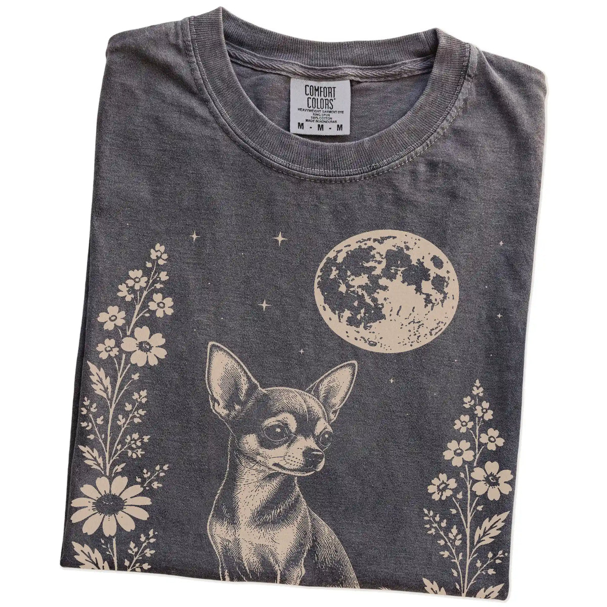 Folded Pepper Comfort Colors® T-shirt showing Chihuahua framed by flowers beneath the moon
