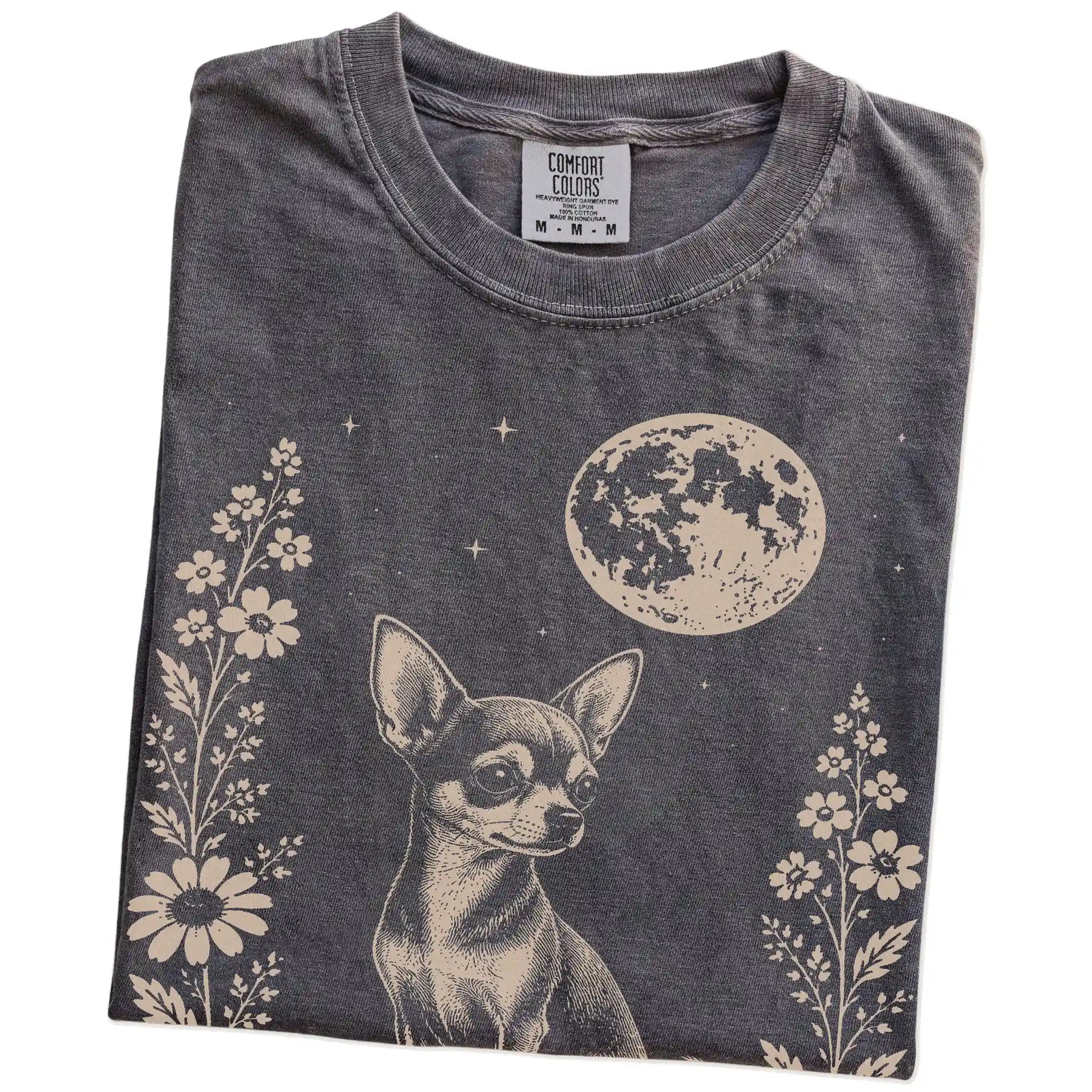Folded Pepper Comfort Colors® T-shirt showing Chihuahua framed by flowers beneath the moon