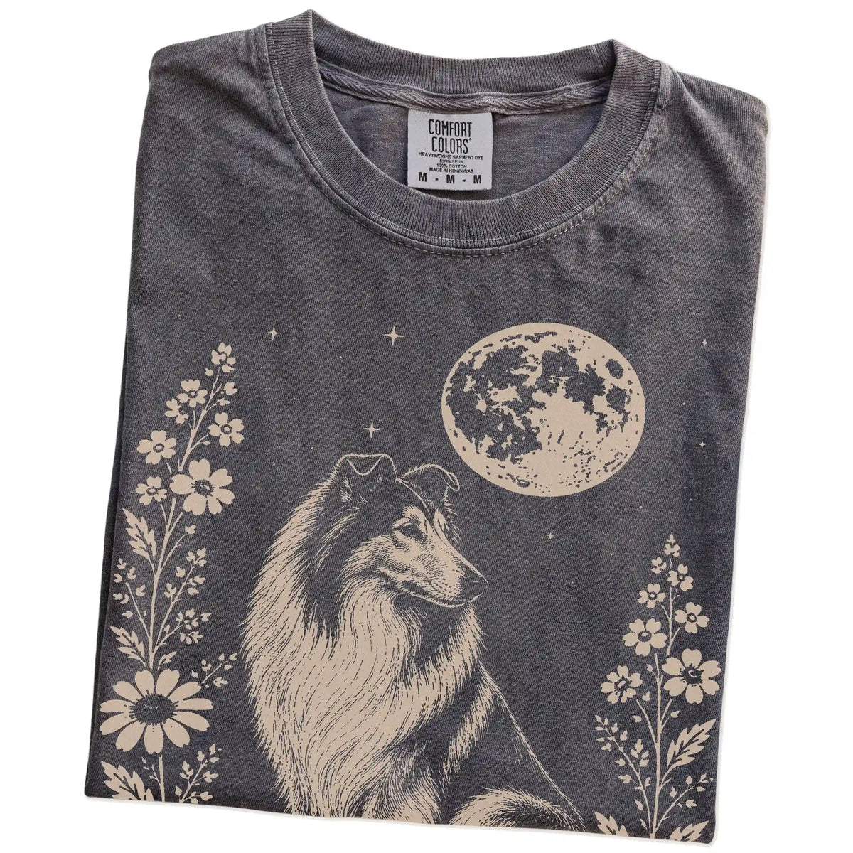 Folded Pepper Comfort Colors® T-shirt showing Collie framed by flowers beneath the moon