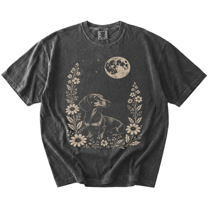 Dachshund framed by flowers beneath the moon on a Pepper Comfort Colors® T-shirt