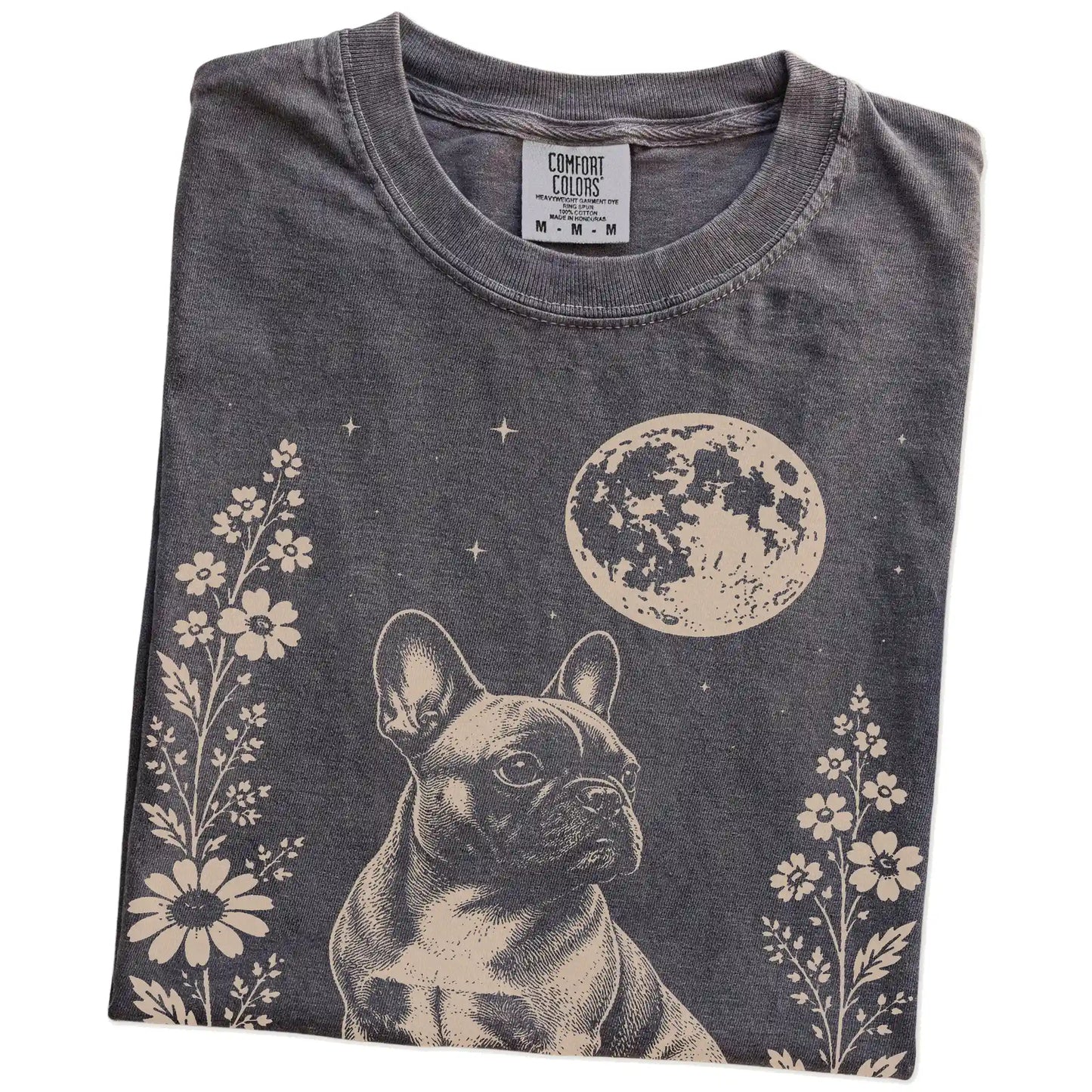 Folded Pepper Comfort Colors® T-shirt showing French Bulldog framed by flowers beneath the moon