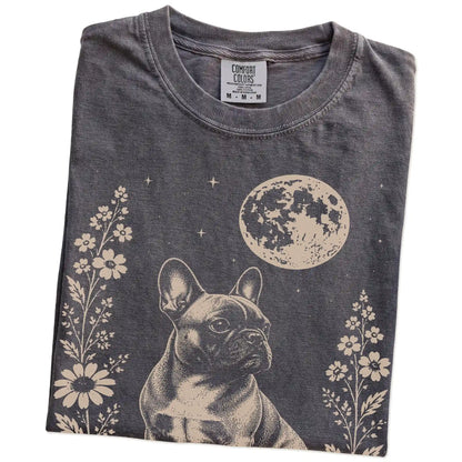 Folded Pepper Comfort Colors® T-shirt showing French Bulldog framed by flowers beneath the moon