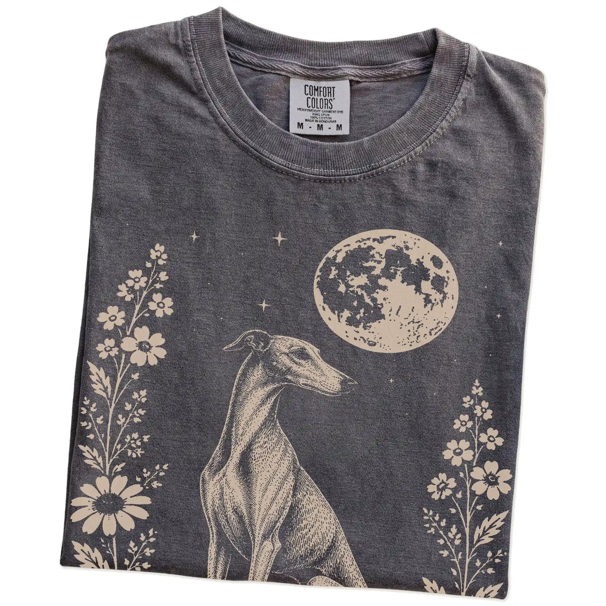 Folded Pepper Comfort Colors® T-shirt showing Greyhound framed by flowers beneath the moon