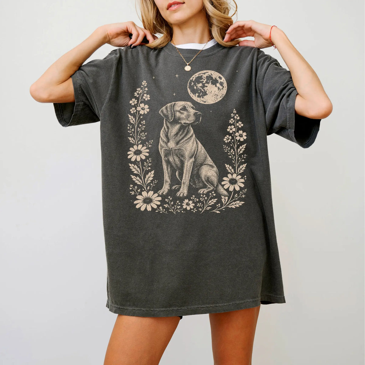 Model wearing a Pepper Comfort Colors® T-shirt featuring Labrador Retriever framed by flowers beneath the moon