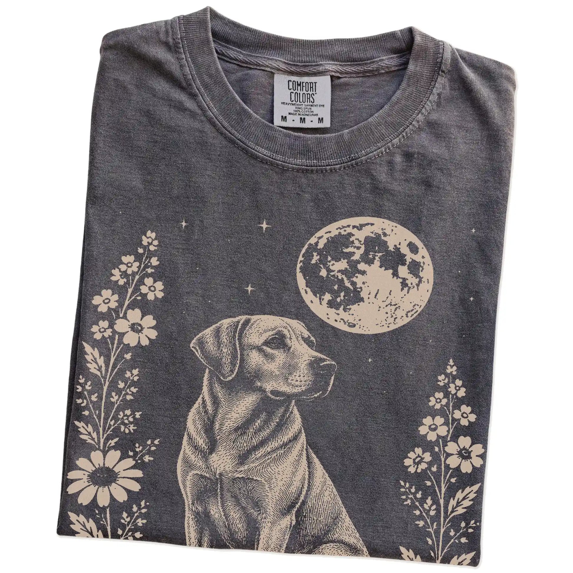 Folded Pepper Comfort Colors® T-shirt showing Labrador Retriever framed by flowers beneath the moon