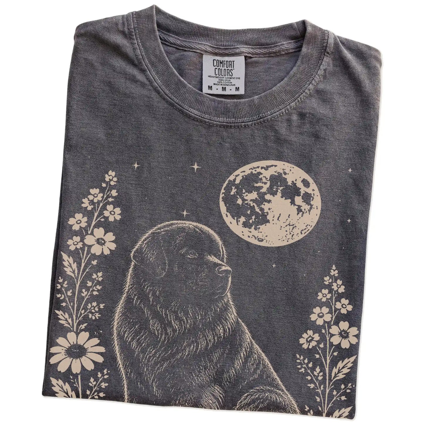 Folded Pepper Comfort Colors® T-shirt showing Newfie framed by flowers beneath the moon