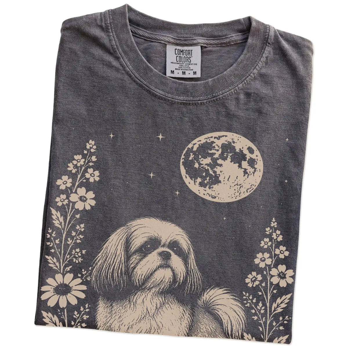 Folded Pepper Comfort Colors® T-shirt showing Shih Tzu framed by flowers beneath the moon