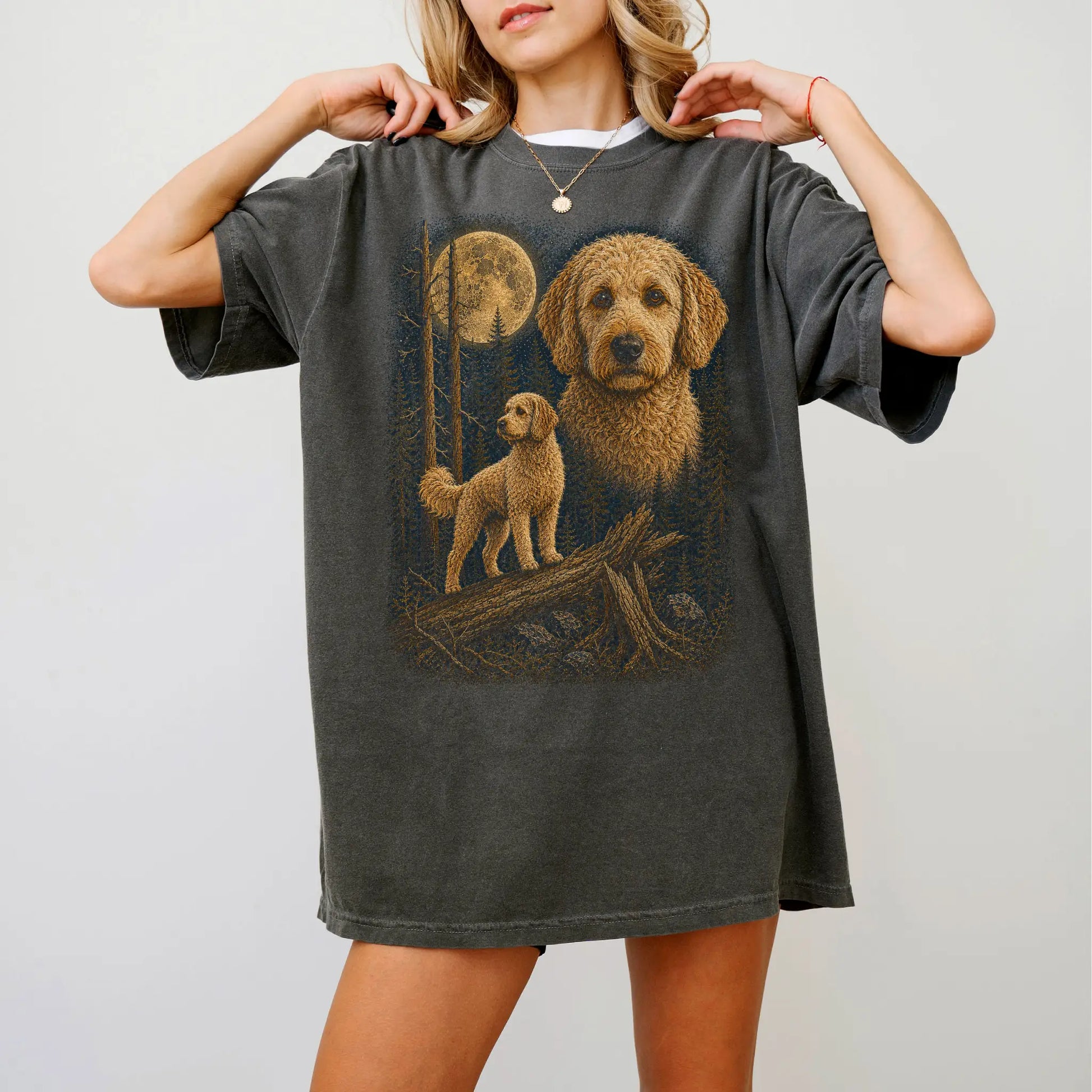 Person wearing a Pepper Goldendoodle full-color Moonlit Forest t-shirt