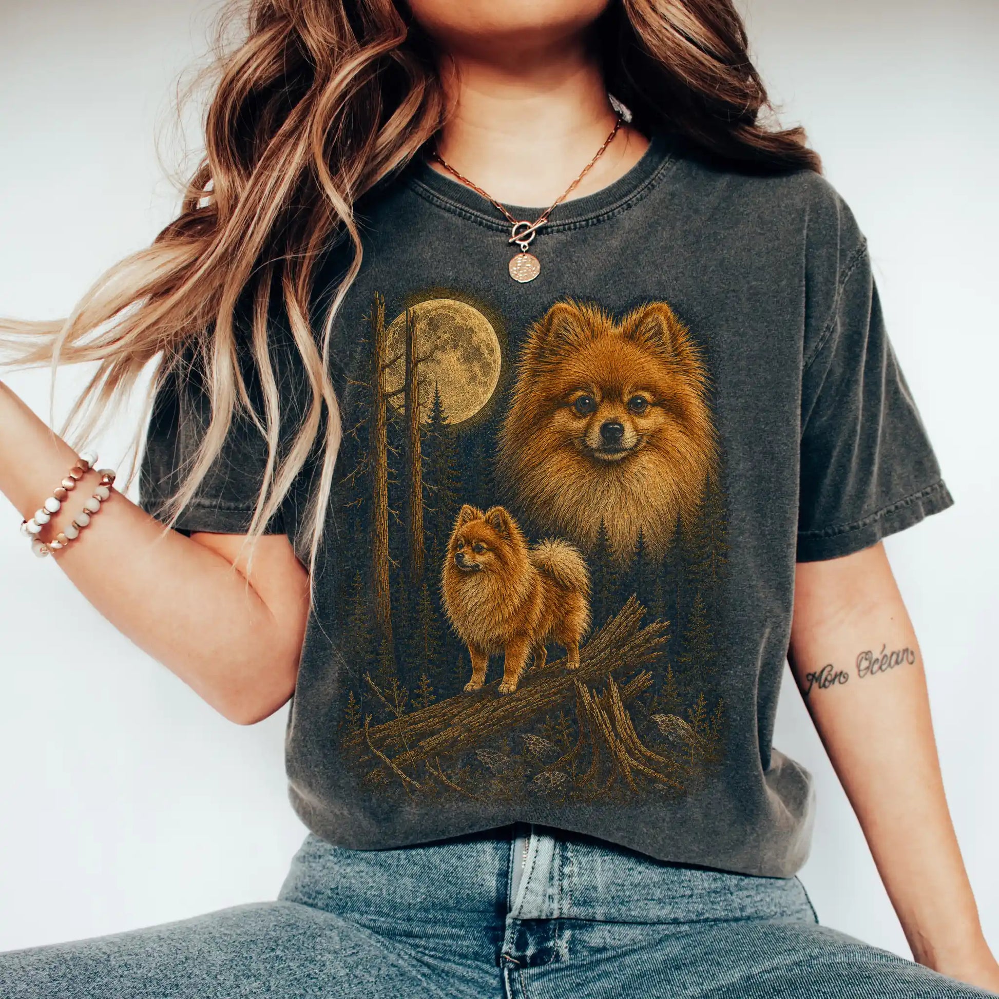 Person wearing a Pepper Pomeranian full-color Moonlit Forest t-shirt