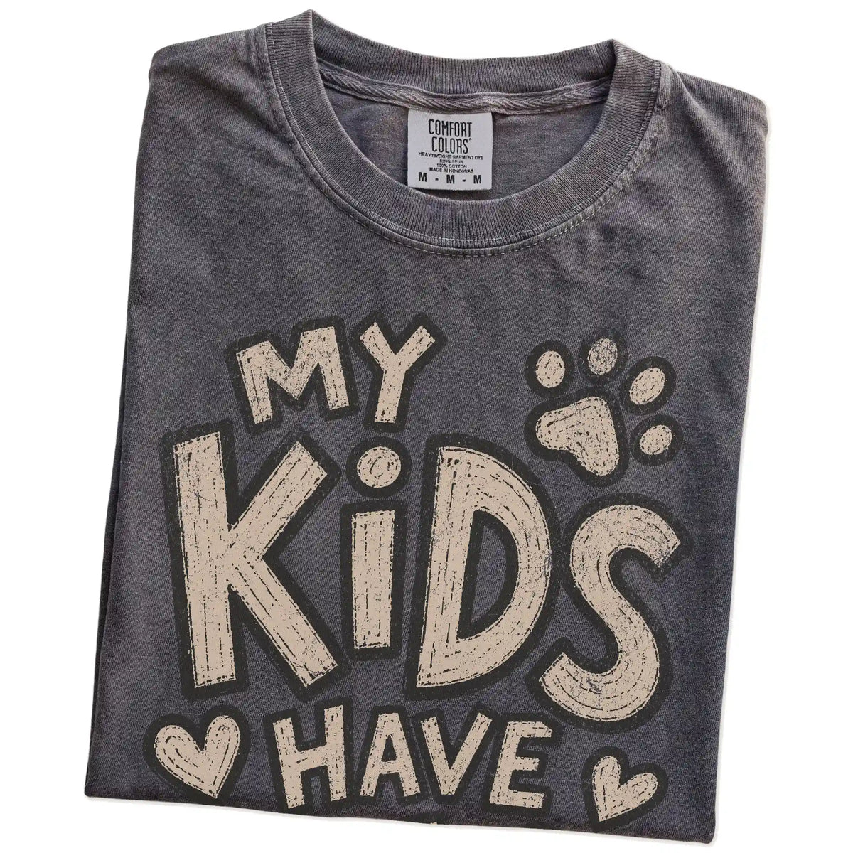 Folded Pepper Comfort Colors® T-shirt showing my kids have paws lettering