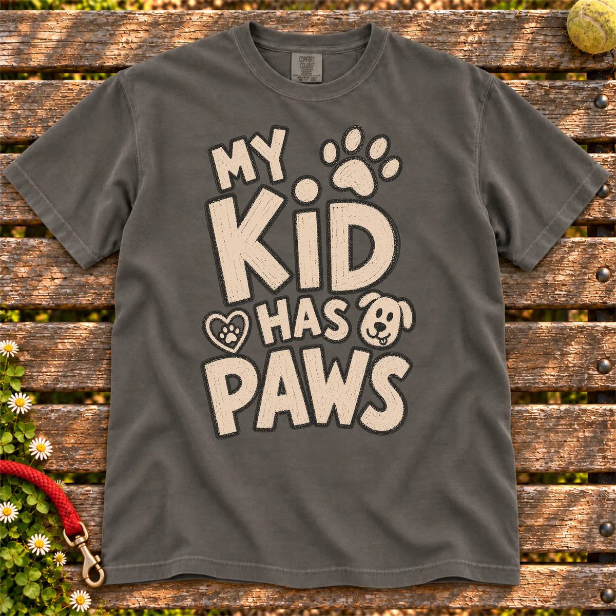 My Kid Has Paws design on a Pepper Comfort Colors T-shirt, shown flat