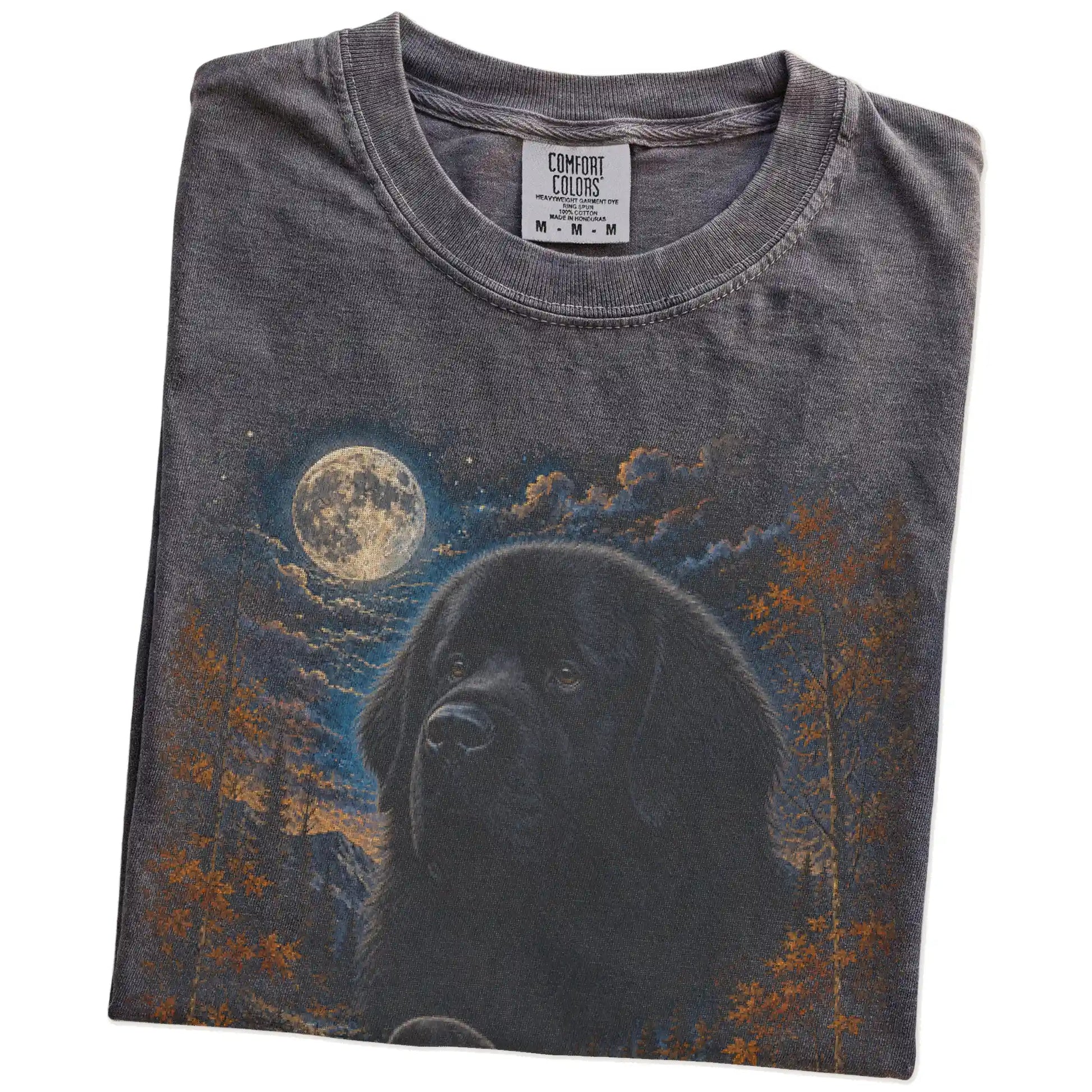 Folded Pepper Comfort Colors® t-shirt showing Newfie in a fall forest graphic