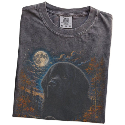 Folded Pepper Comfort Colors® t-shirt showing Newfie in a fall forest graphic