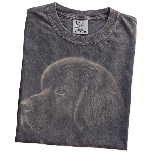 Folded Pepper Comfort Colors® T-shirt showing a detailed photographic portrait of a Newfie