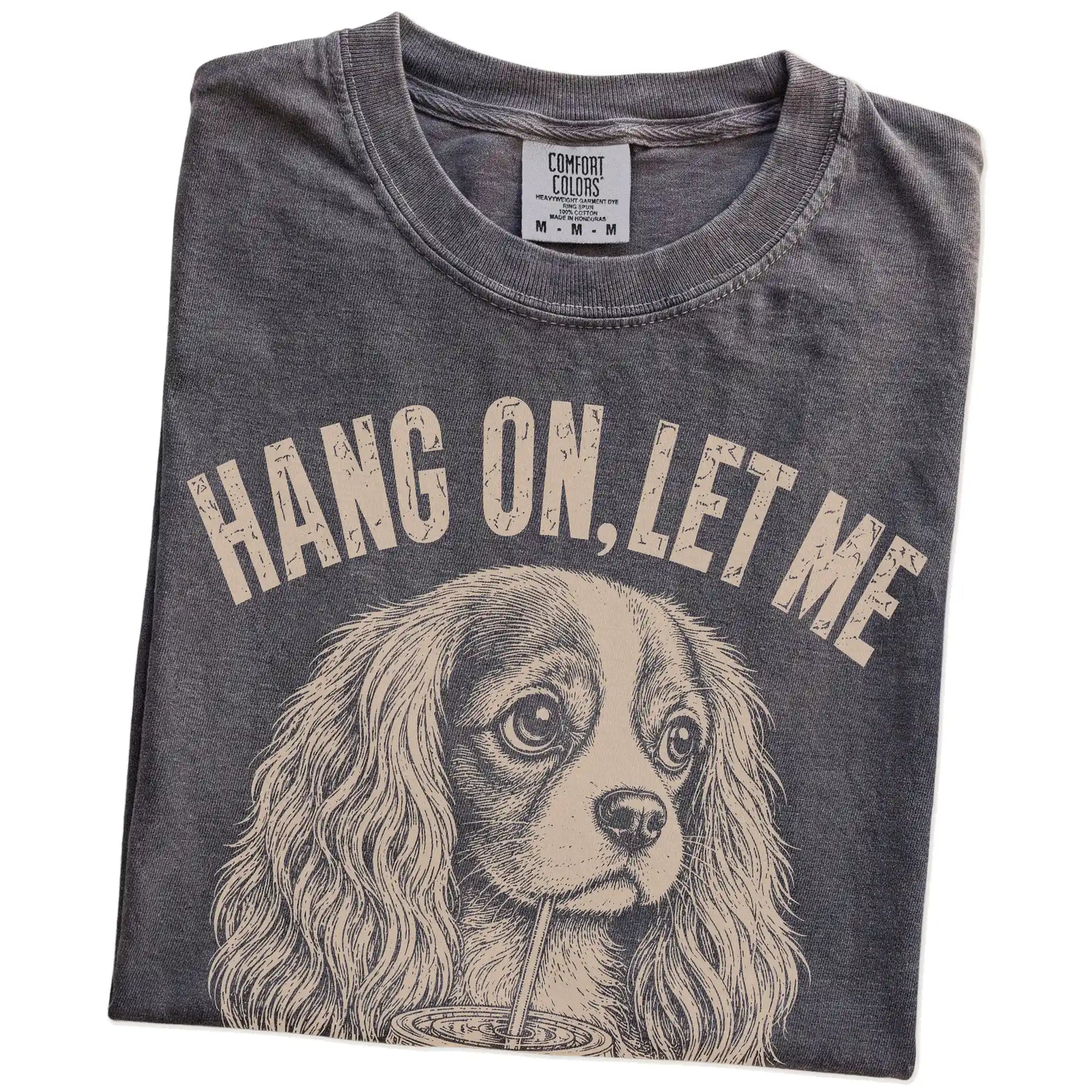 Folded Pepper Overthinking Cavalier King Charles Spaniel T-Shirt showing the graphic