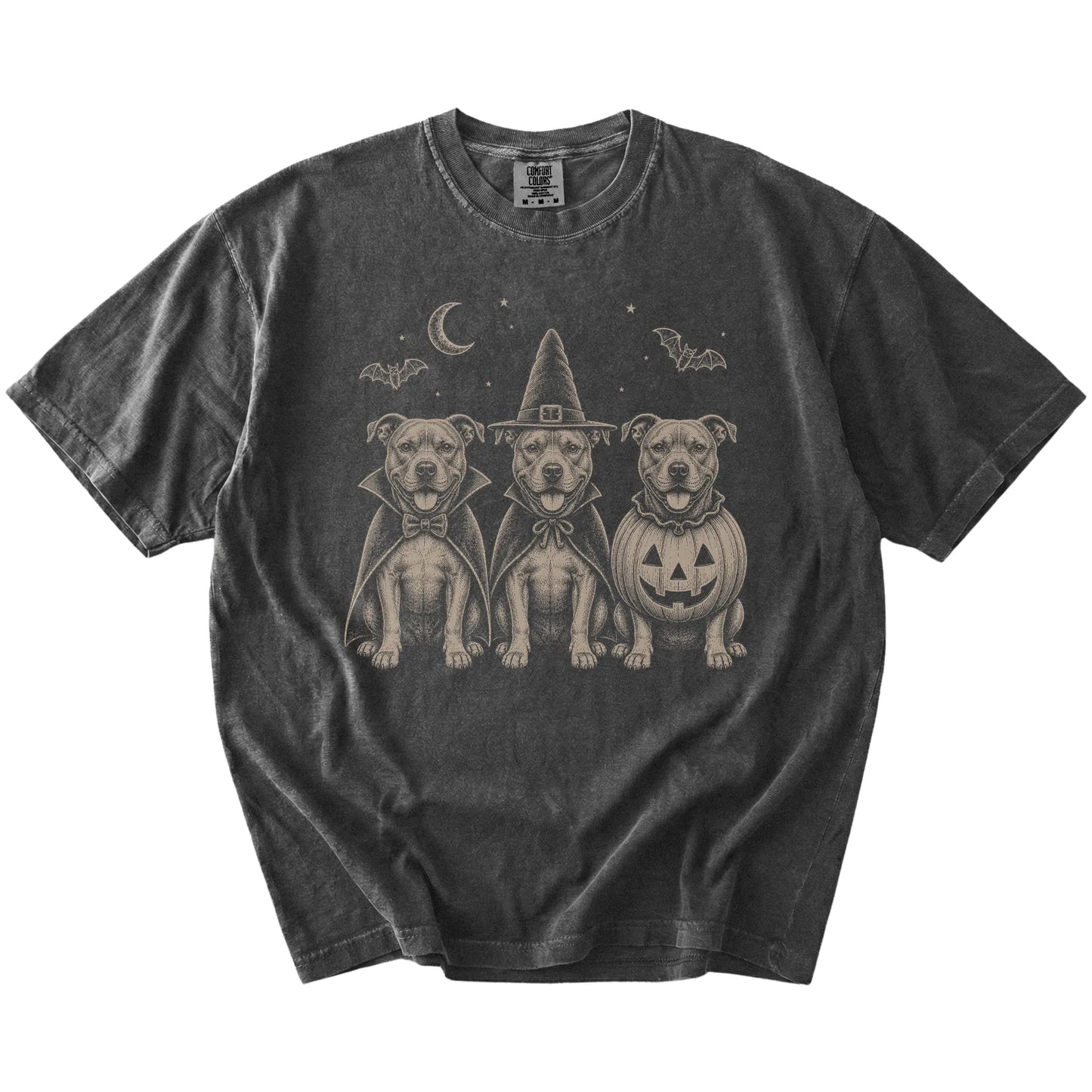 Three Pitbull dogs dressed for Halloween beneath bats and a crescent moon on a Pepper Comfort Colors® T-shirt