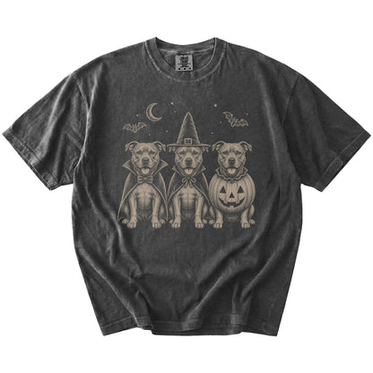 Three Pitbull dogs dressed for Halloween beneath bats and a crescent moon on a Pepper Comfort Colors® T-shirt