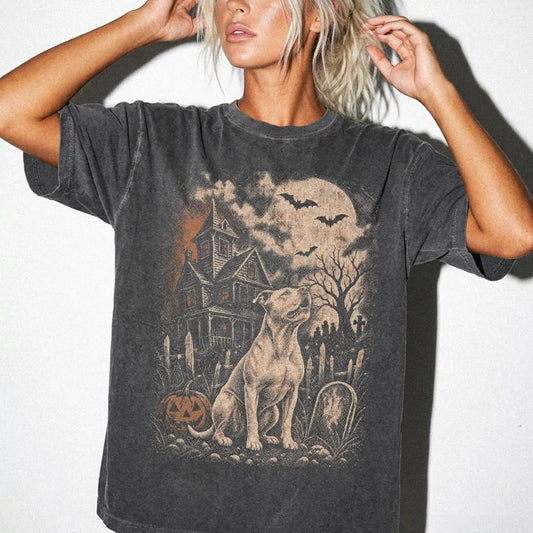 Model wearing a Pepper Comfort Colors® T-shirt showing Pitbull in a vintage haunted-house scene